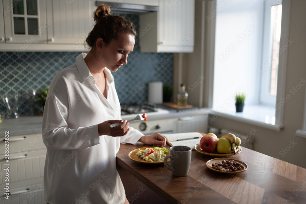 Businesswoman having breakfast at home Businesswoman having breakfast at home