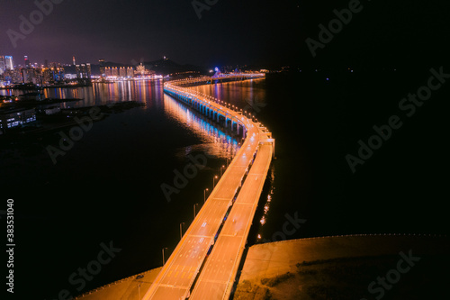 Aerial photo of the lights of the cross sea bridge at night was taken in Dalian, Liaoning Province, Asia
