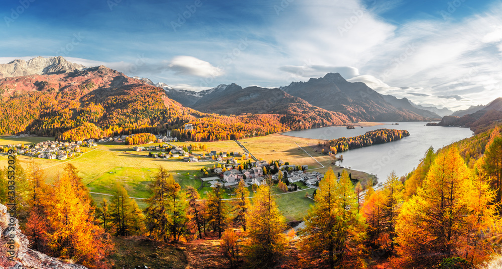 Panorama of Sils village and lake Sils (Silsersee) in Swiss Alps mountains. Colorful forest with orange larch. Switzerland, Maloja region, Upper Engadine. Landscape photography