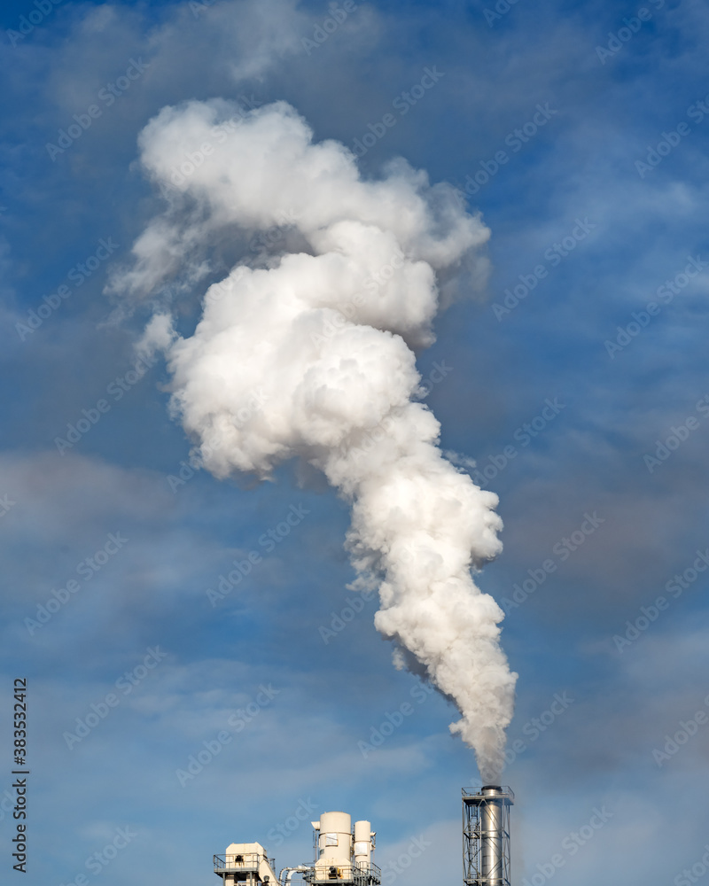 Smoke coming from the chimneys of the plant factory. Air pollution concept