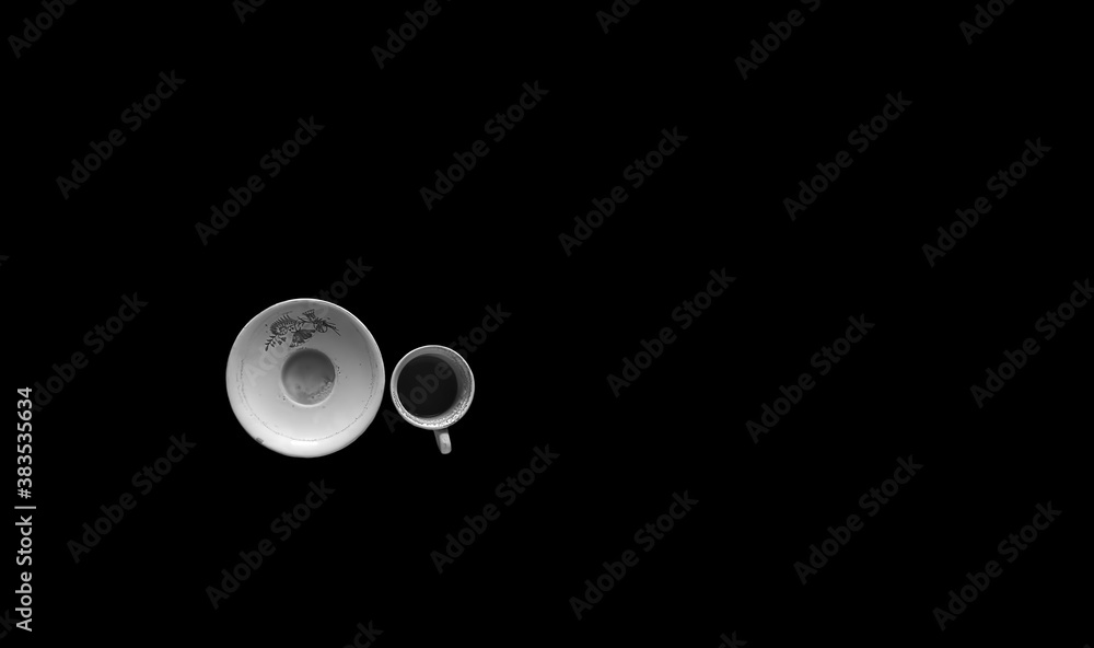 Top shot of an empty used teacup isolated on black background. Top shot of an empty used teacup isolated on black background.