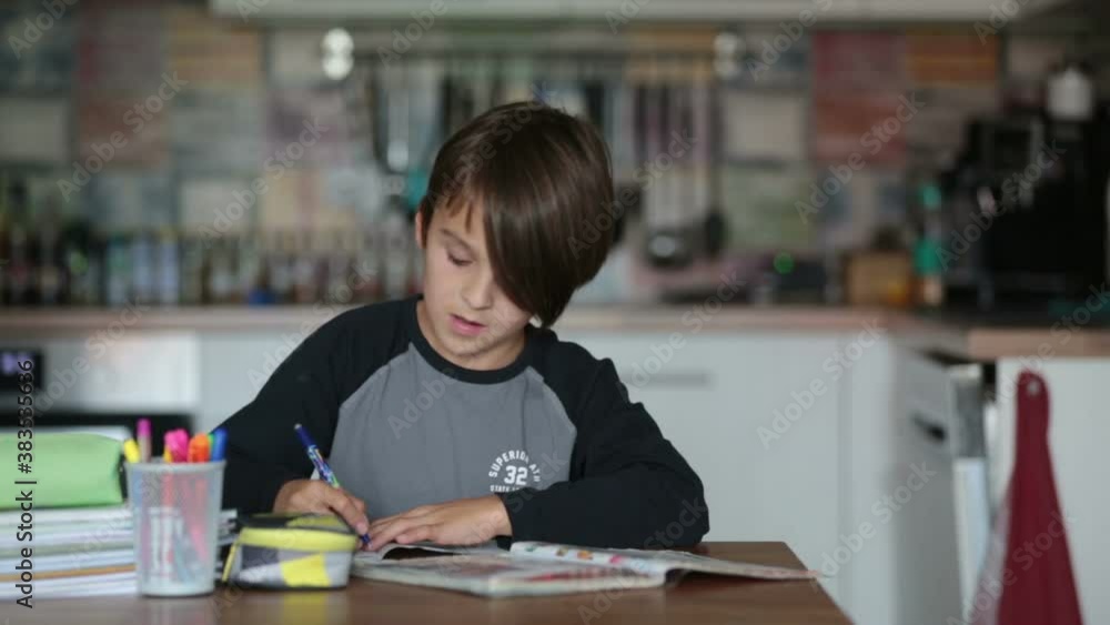 Child, writing homeworks, kid learning at home during pandemic Covid ockdown Child, writing homeworks, kid learning at home during pandemic Covid ockdown