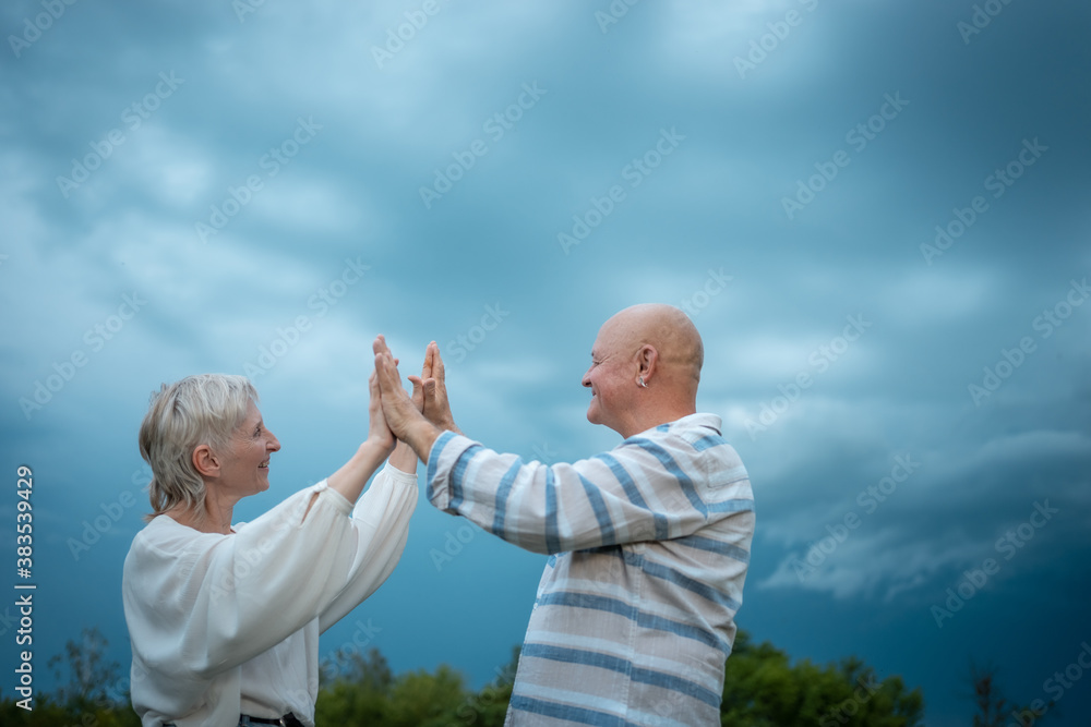 Fototapeta premium happy senior couple have romantic dating and dancing outdoor at summer