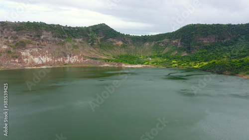 Scenery of Crater lake on the top of Taal volcano. Aerial drone. Green lake, Taal Volcano