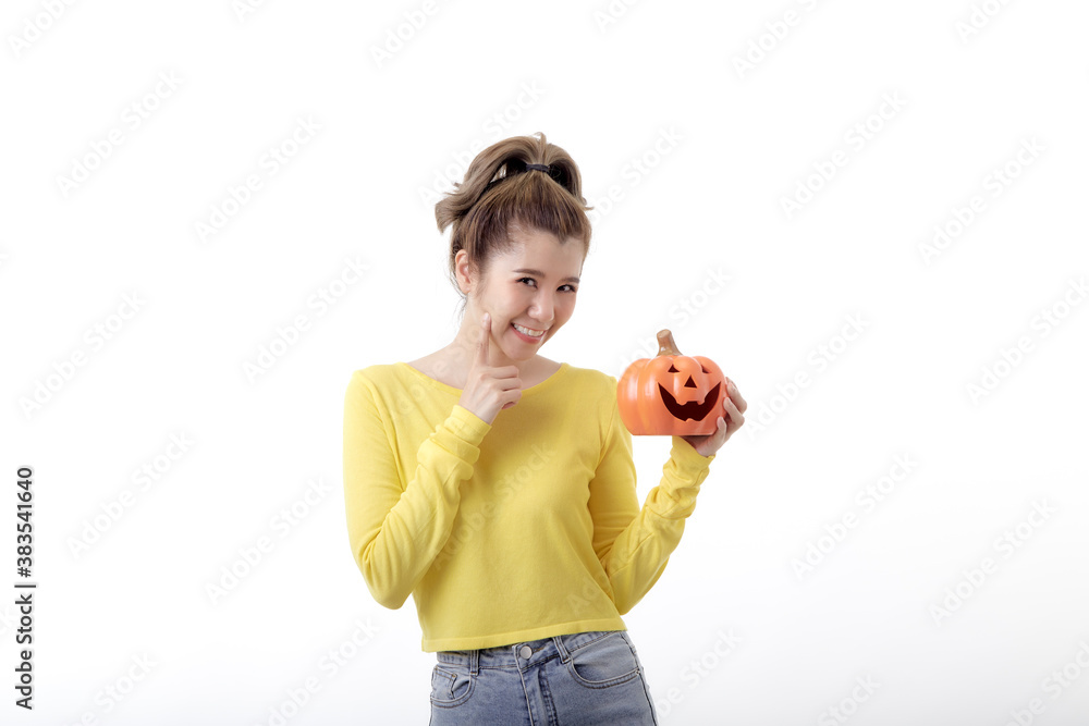 Young woman holding a pumpkin in halloween on white Young woman holding a pumpkin in halloween on white