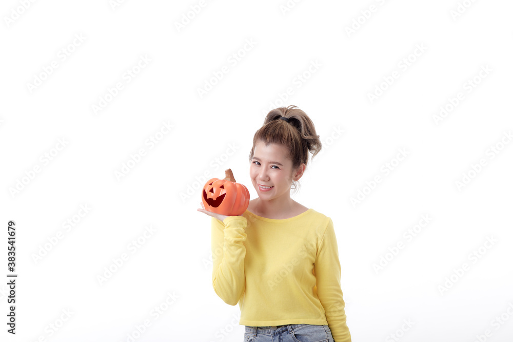 Young woman holding a pumpkin in halloween on white Young woman holding a pumpkin in halloween on white