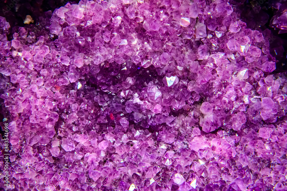Large geode of amethyst crystals. Purple palette. Soft selective focus. Large geode of amethyst crystals. Purple palette. Soft selective focus.