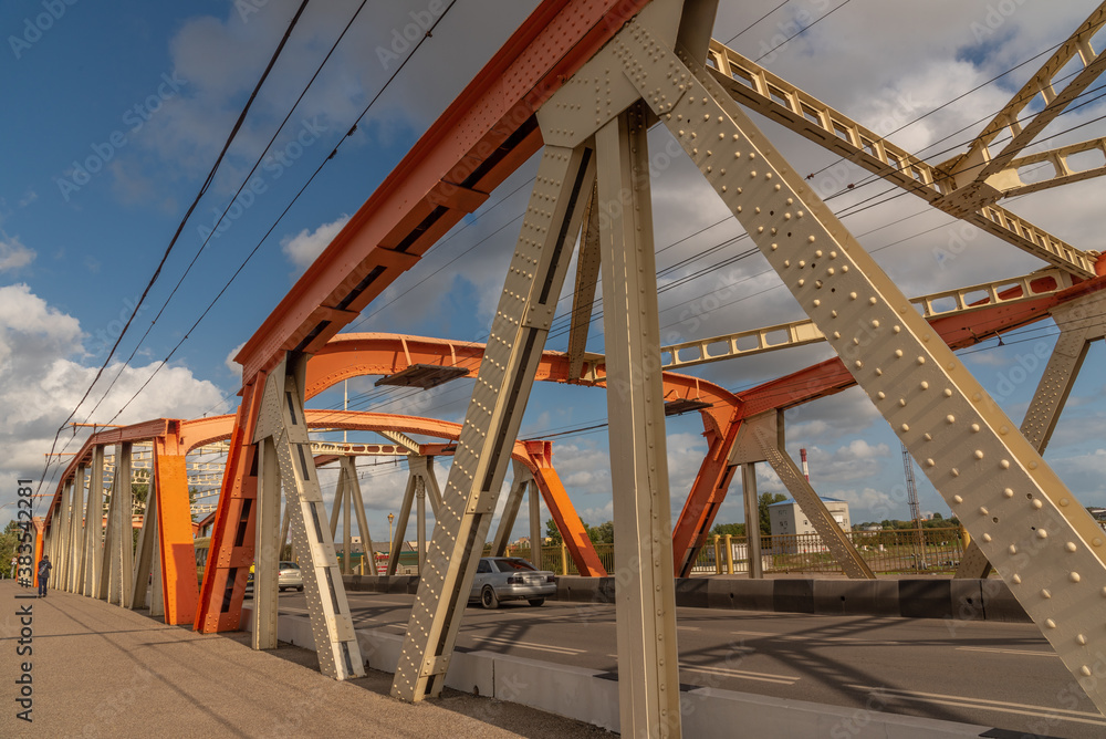 Metal road bridge with passing cars. Metal road bridge with passing cars.