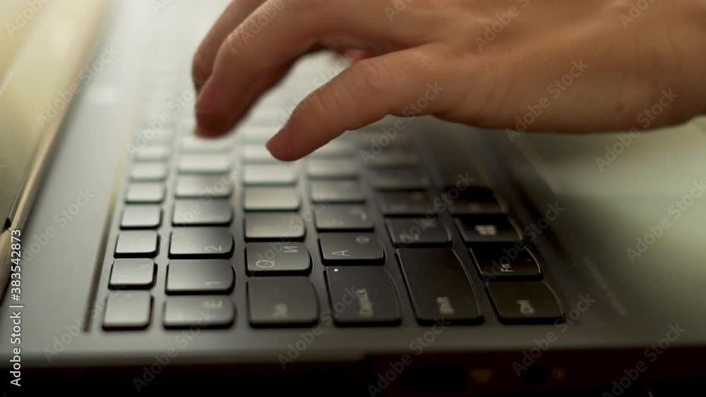 The Person Typing on the Laptop Keyboard. Work, Blogging, Using the Internet Close-up, Macro. Closeup of Hands Fingers and Keyboard. The Person Typing on the Laptop Keyboard. Work, Blogging, Using the Internet Close-up, Macro. Closeup of Hands Fingers and Keyboard.