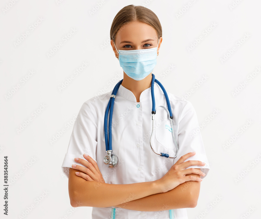 concept of fighting and prevention coronavirus infection covid 19. a doctor put on protective medical mask . concept of fighting and prevention coronavirus infection covid 19. a doctor put on protective medical mask .
