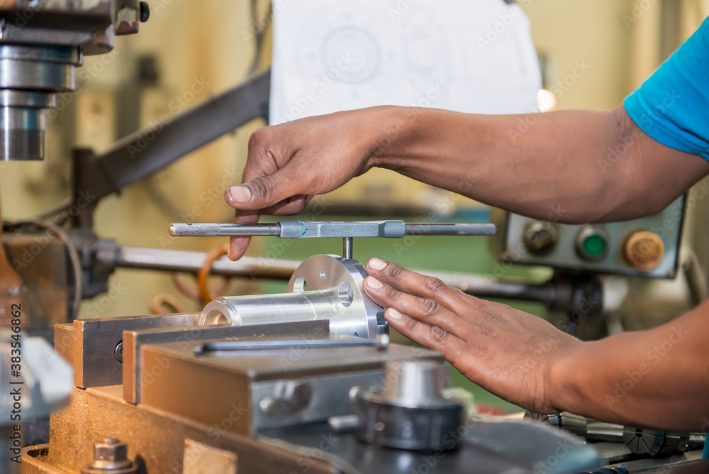 The tapping operation by skill worker. The thread making by hand tapping tool with The tapping operation by skill worker. The thread making by hand tapping tool with