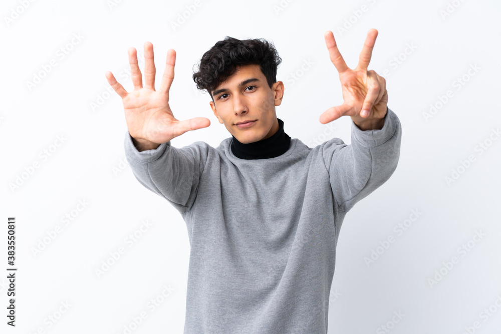 Young Argentinian man over isolated white background counting eight with fingers Young Argentinian man over isolated white background counting eight with fingers
