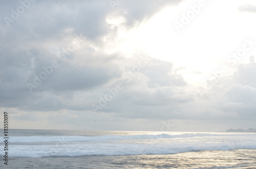 Sea long exsposure at sunset with cloudy sky. in the South Java Beach