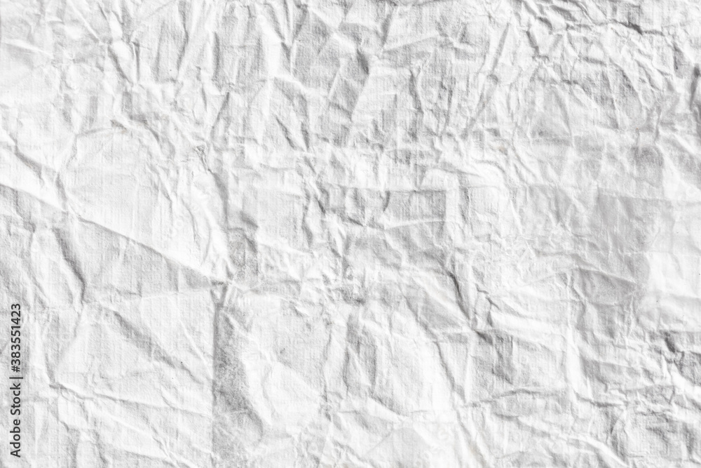Fototapeta premium Crumpled white paper as an abstract background.