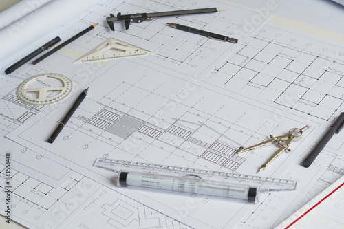 Architect engineer contractor design working drawing sketch plan blueprint and making architectural construction house building in architect studio.