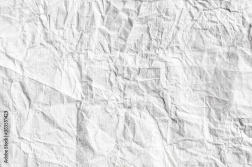 Crumpled white paper as an abstract background.