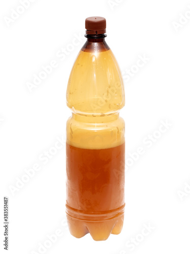 Plastic bottle with beer isolated on a white background.