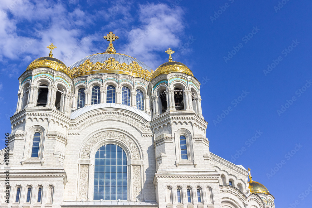 Kronshtadt, Saint Petersburg, Russia,09.08.2020. The Cathedral of St. Nicholas the Wonderworker. Blue sky, clouds and sunny weather. important religious site.