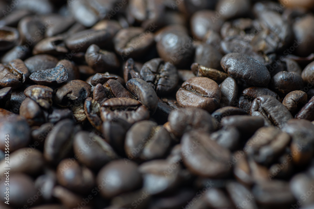 Roasted brown coffee beans as background. Perspective Roasted brown coffee beans as background. Perspective