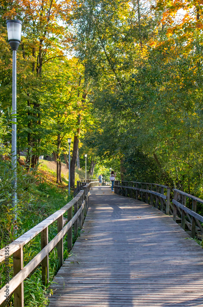Wooden walking paths in the park. Nature walks in October. Autumn in Anykšiai Wooden walking paths in the park. Nature walks in October. Autumn in Anykšiai