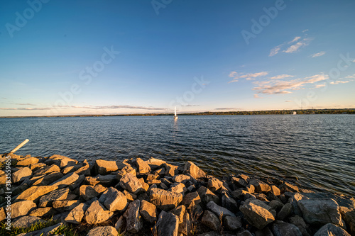 Sailing on the lake at sunset © contentzilla