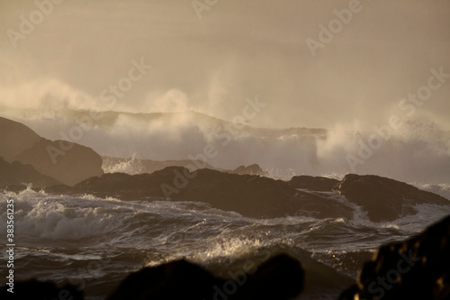 Stormy sea waves at sunset