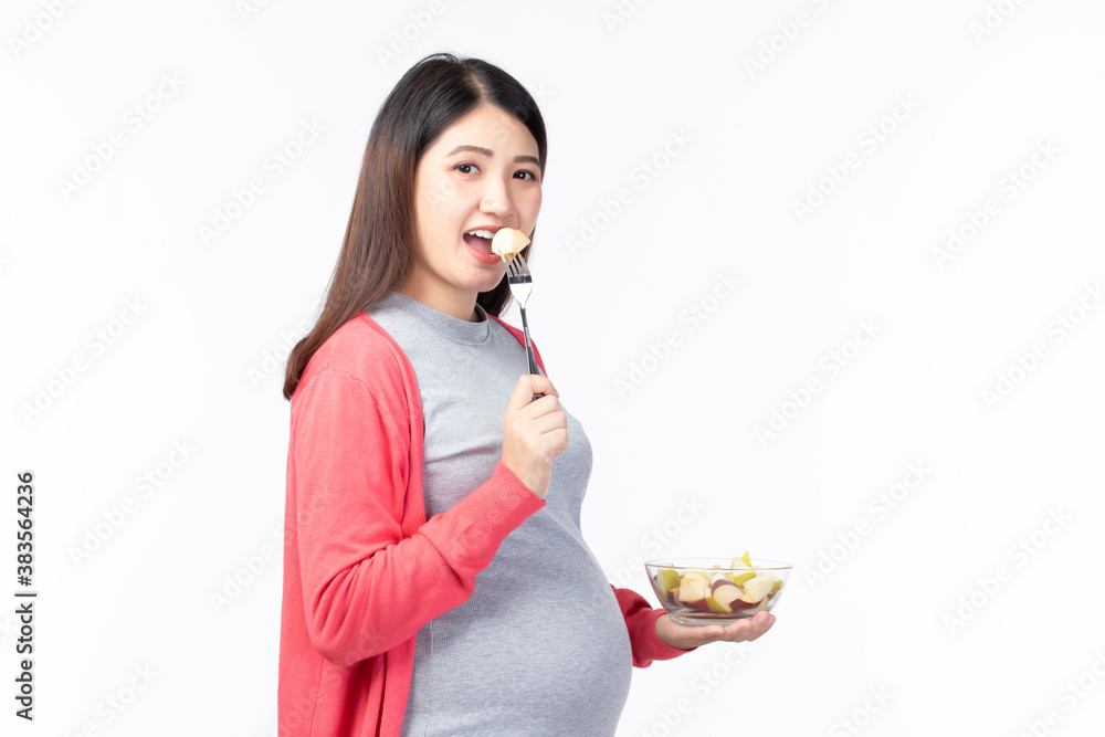 Happy pregnant young asian mother with fruits healthy food for baby and pregnant woman isolated on white background with copy space. Healthy Food Concept. Happy pregnant young asian mother with fruits healthy food for baby and pregnant woman isolated on white background with copy space. Healthy Food Concept.