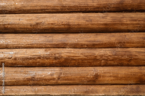 Foto A wall of brown lacquer Logs. Textured background.