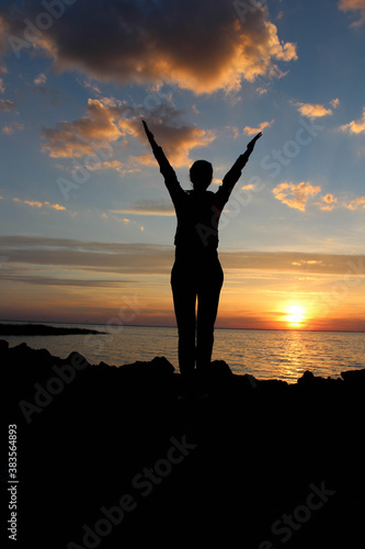 silhouette of a person in the sunset