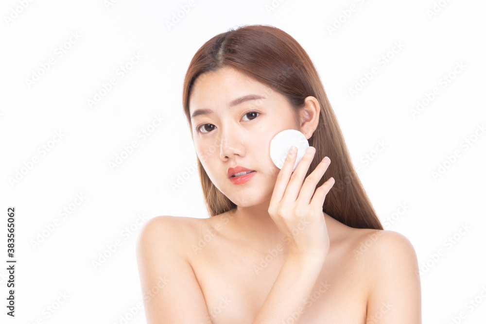 Attractive beauty young asian woman clean skin with cotton pad removing make up. Happy pretty girl cleaning her face with cotton pads isolated on white background Attractive beauty young asian woman clean skin with cotton pad removing make up. Happy pretty girl cleaning her face with cotton pads isolated on white background