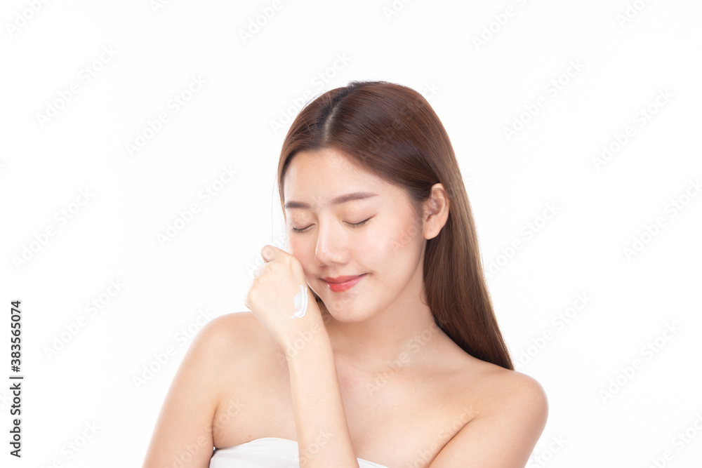 Beautiful happy woman applying cream face on shoulder. Closeup portrait healthy smiling female model with natural make up fresh soft pure skin applying moisturizing lotion. Beautiful happy woman applying cream face on shoulder. Closeup portrait healthy smiling female model with natural make up fresh soft pure skin applying moisturizing lotion.