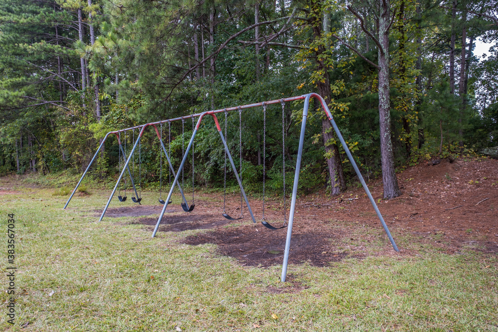 Empty playground swing set at the park Empty playground swing set at the park