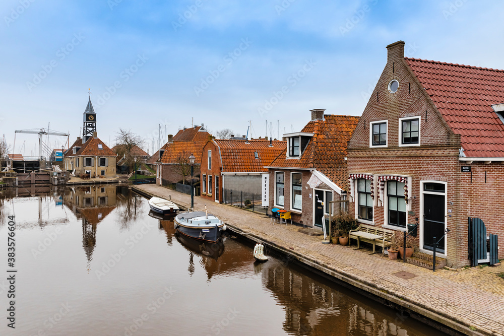 Townscape with old sluice and residential buildings in Hindeloopen, Netherlands