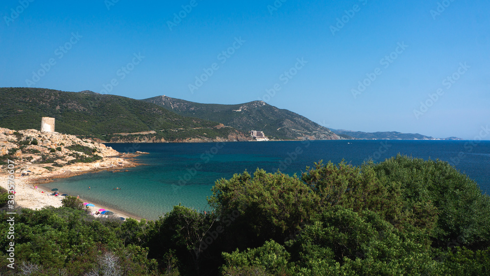 Beautiful sea and bay on Chia beach and view of Torre del Budello, Sardinia island, Italy