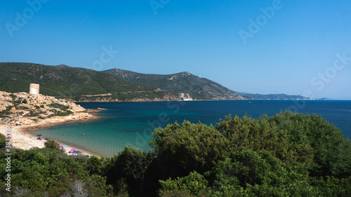 Beautiful sea and bay on Chia beach and view of Torre del Budello, Sardinia island, Italy