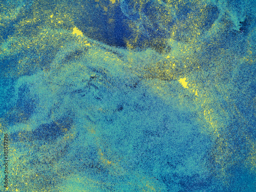 Blue grunge background with gold.