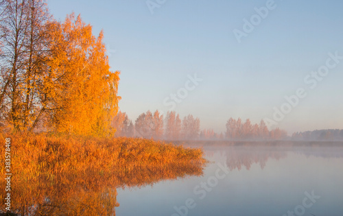 Autumn fog in the morning on the river