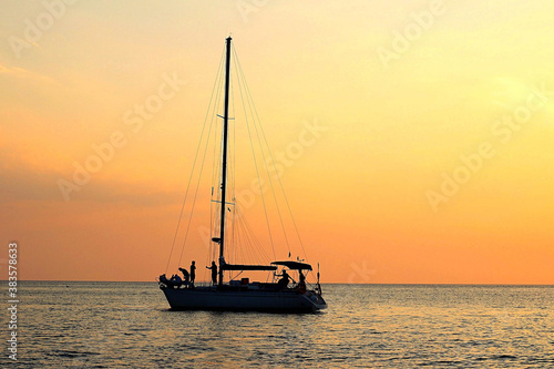 sailboat at sunset © NATALIIA