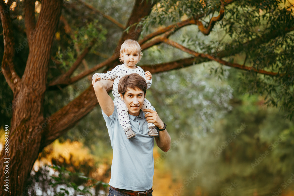 Obraz premium happy family father and son walking in nature