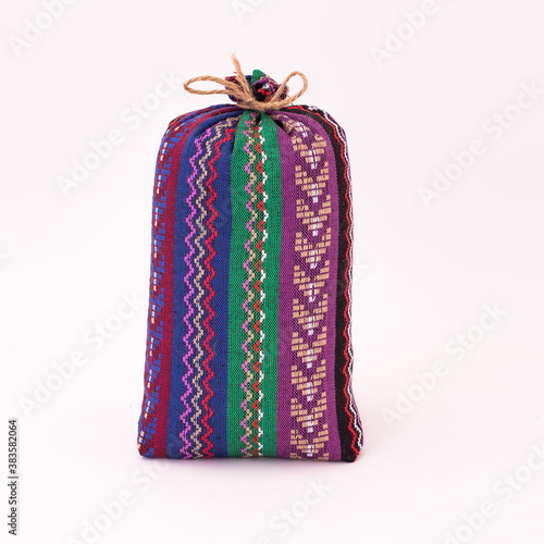 Colourful handmade traditional coffee bag in isolated white background