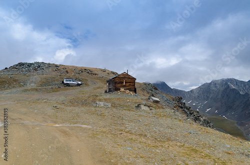 Lonely wooden house on top of a mountain.