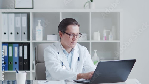 Wallpaper Mural Professional medical doctor working in hospital office using computer. Torontodigital.ca
