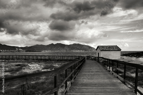 Wooden boardwalk along the beach in Isla Plana village