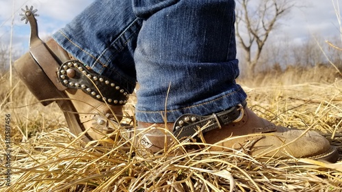 cowboy boots on hay