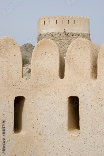 Closeup of Al Bidyah Mosque with watchtower in the background, Bidyah, Dubai, UAE photo