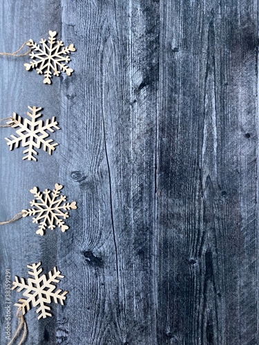 Snowflakes on wood background