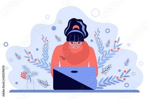 A young woman working at a computer. Freelance worker, self-employed, student. Online education. Winter workplace interior design.