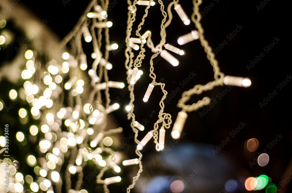 Christmas lights on the christmas tree outdoors, holidays, new year card - obrazy, fototapety, plakaty 