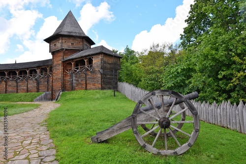 The territory of the wooden Cossack fortress with restored historical buildings in Baturin Ukraine. Ukrainian heritage, tourist attractions. Medieval wooden fortress in Chernihiv region near the Seym  photo