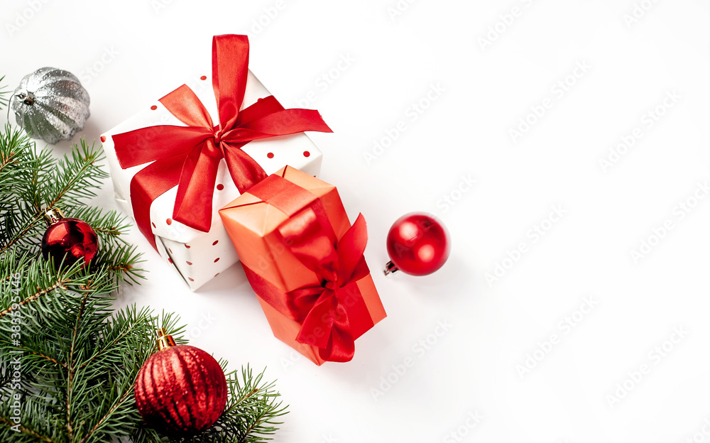 Postcard, frame, banner. New Year. Christmas handmade gift boxes and fir trees on white background with copy space for your text Postcard, frame, banner. New Year. Christmas handmade gift boxes and fir trees on white background with copy space for your text